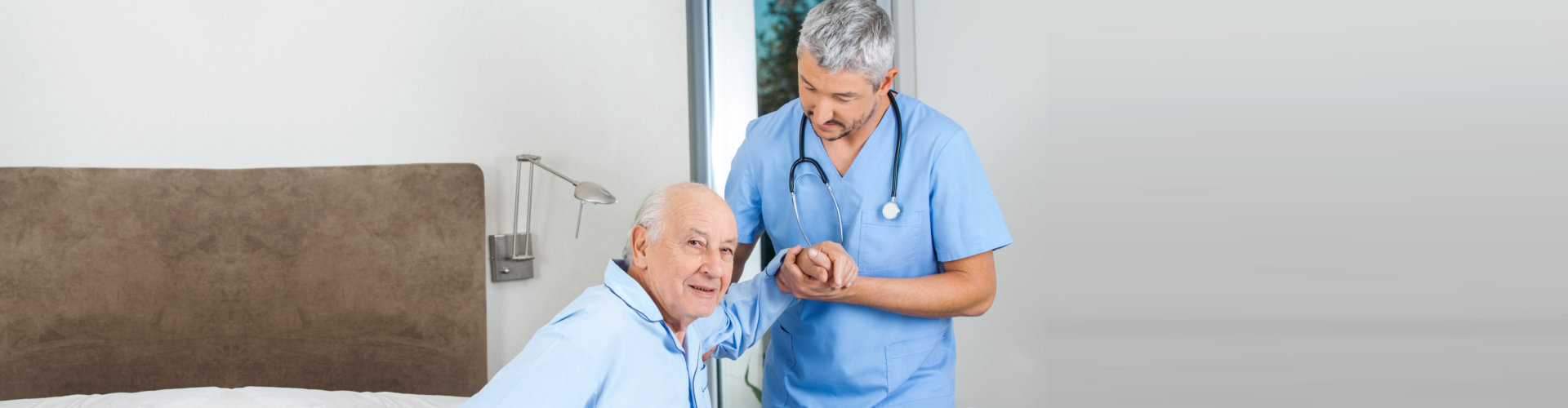 nurse assisting senior man